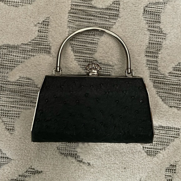 Bijoux Terner Handbags - Tiny‎ clutch bag with handle.